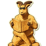 La chèvre en bois à lunettes qui lit, sculptée devant le magasin